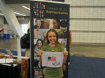 Young person displays her prayer flag